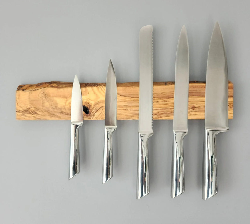 Olive wood knife holder displaying a unique grain pattern and strong magnets