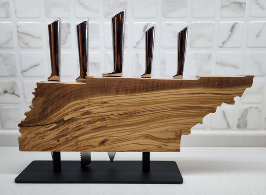 Wooden knife holder on a marble background